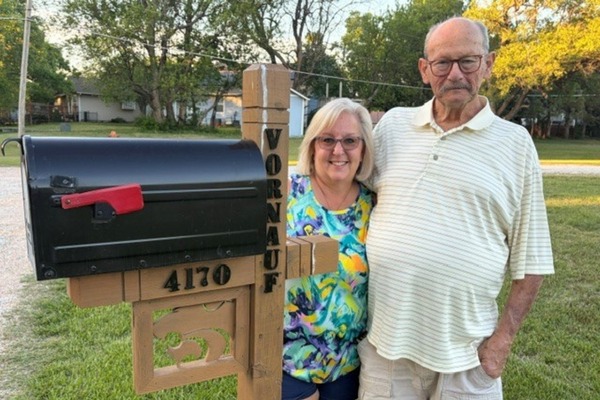 Forrest and Katie V. with a mailbox he made.